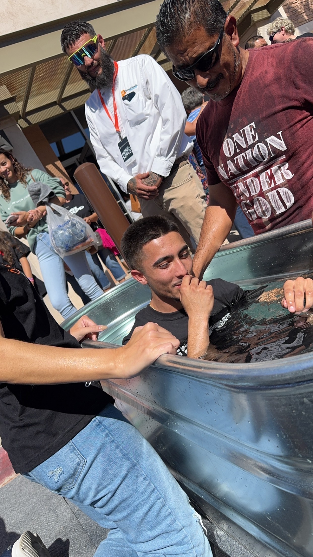 A baptism gathering with Robert and his church community